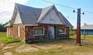 Threatt Filling Station and Family Farm in landscape