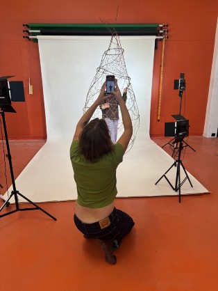 Figure 7: Students photographing their 3D work at a public documentation station during a photo demo.